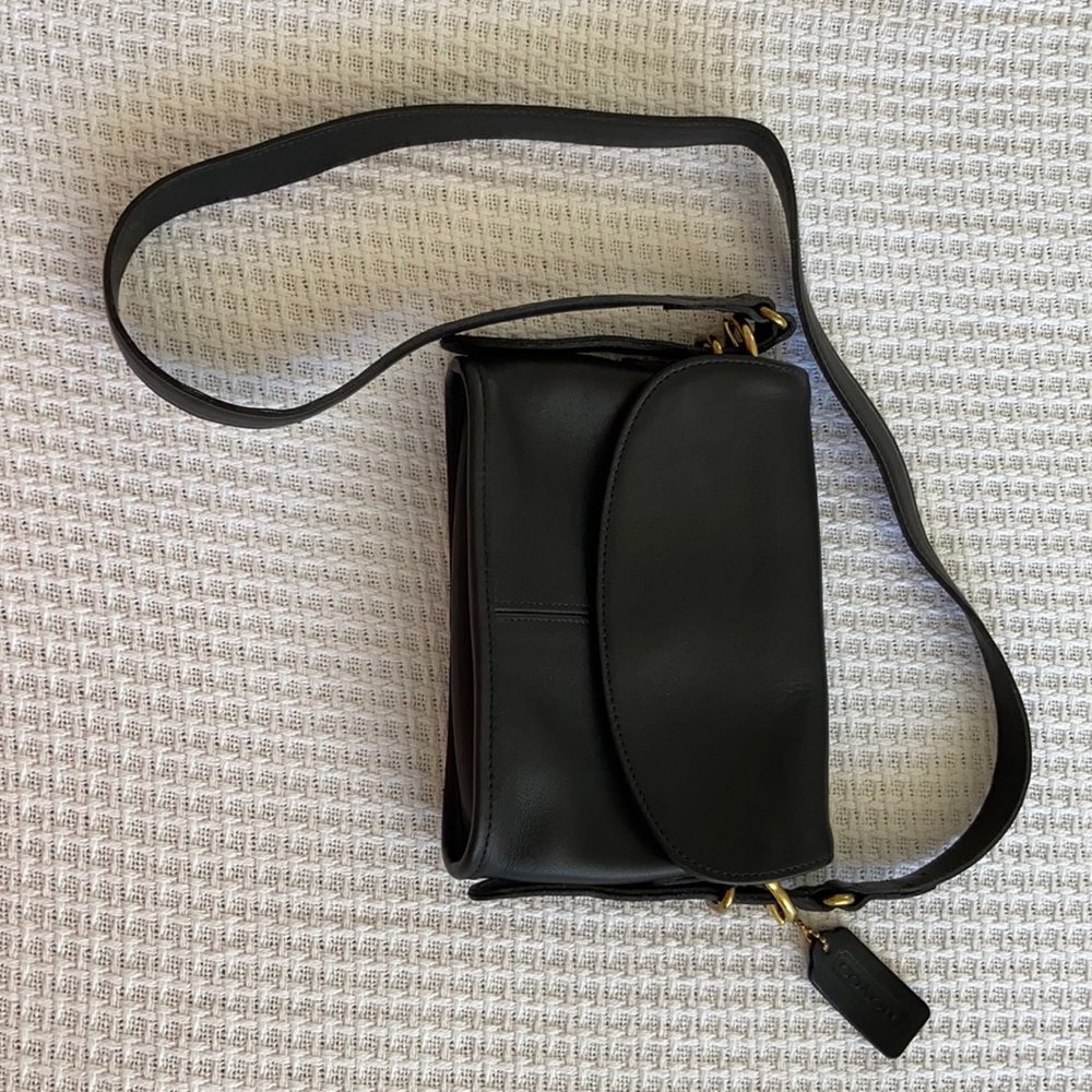 Black leather Coach mini Crossbody bag.